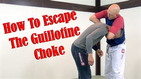 The fight ends with the green shirt guy transitioning to an Armbar and leaving the other man in what seems to be a semi-conscious. . How to pronounce guillotine choke